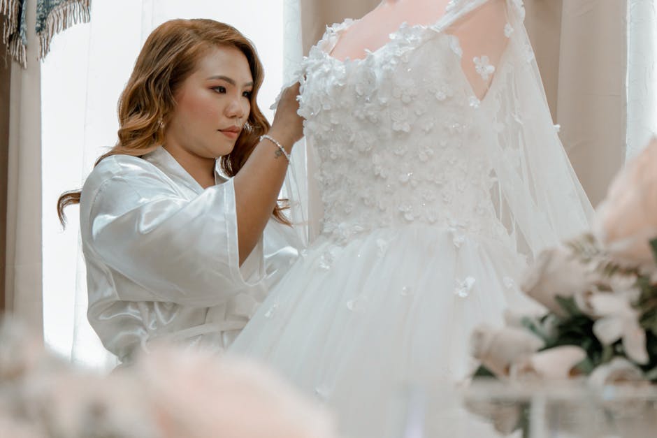 bride trying on a wedding gown at first bridal consultation